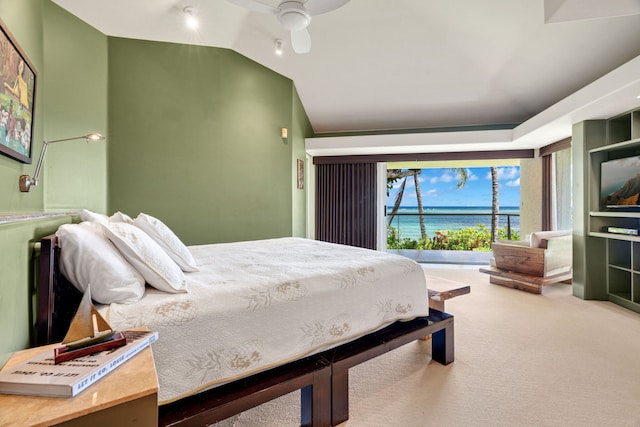 carpeted bedroom with ceiling fan and vaulted ceiling