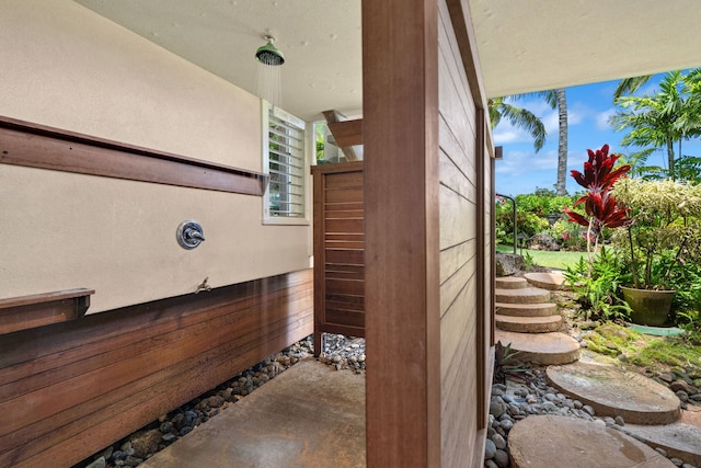 details with wood walls and concrete floors