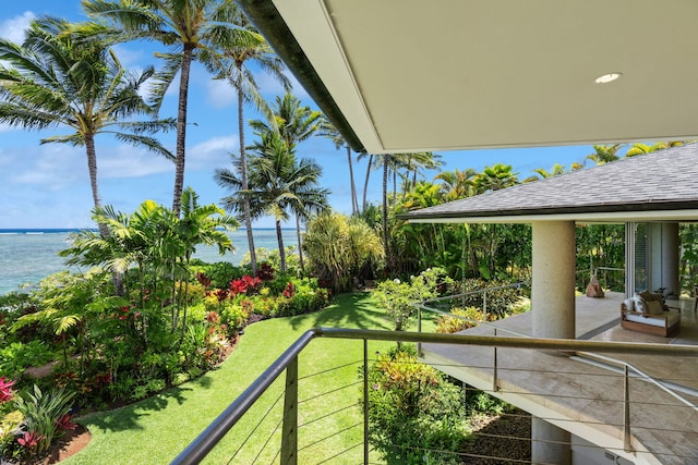 exterior space with a balcony and a water view