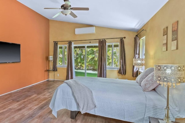 bedroom featuring ceiling fan, a wall mounted AC, lofted ceiling, access to outside, and hardwood / wood-style flooring