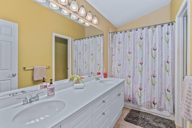 bathroom with shower / bath combination with curtain, vanity, vaulted ceiling, and tile patterned floors