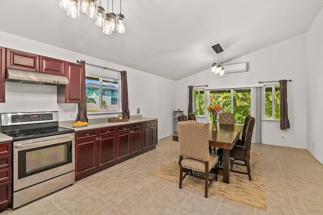 kitchen featuring hanging light fixtures, vaulted ceiling, electric range, light tile patterned floors, and a wall unit AC