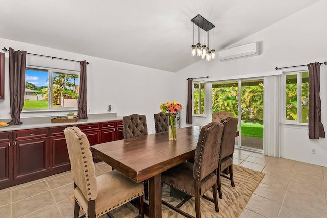 tiled dining room with a notable chandelier, lofted ceiling, and a wall unit AC