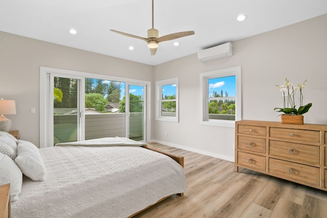 bedroom with access to outside, a wall mounted AC, ceiling fan, and light hardwood / wood-style flooring