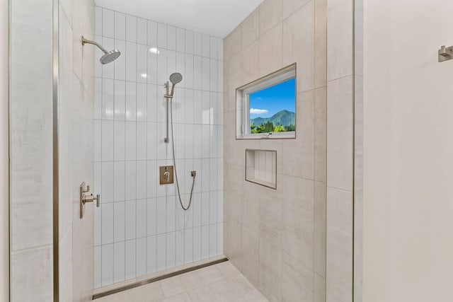 bathroom with a tile shower