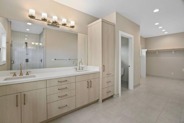 bathroom with vanity and an enclosed shower