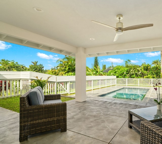 view of swimming pool with ceiling fan and a patio