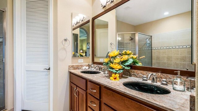 bathroom with vanity and walk in shower