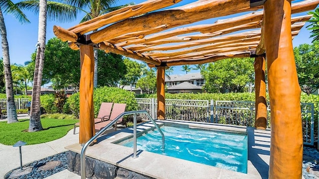 view of swimming pool with an in ground hot tub and a pergola