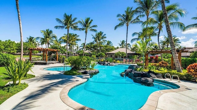 view of pool with a patio area and a pergola