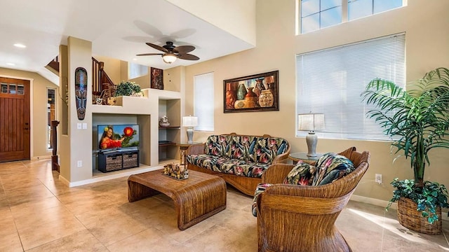 living room featuring ceiling fan and light tile patterned floors