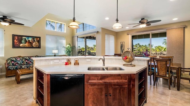 kitchen with pendant lighting, dishwasher, a kitchen island with sink, sink, and ceiling fan