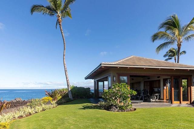 view of yard featuring a water view and a patio