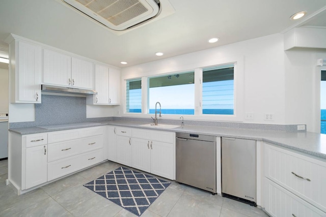 kitchen with sink, white cabinetry, and dishwasher