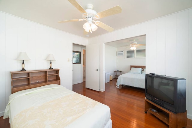 bedroom with ceiling fan and dark hardwood / wood-style floors