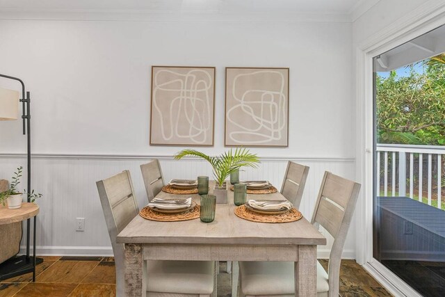 tiled dining area featuring ornamental molding and a wealth of natural light