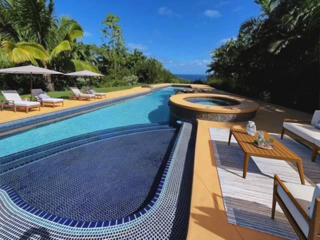 view of swimming pool with an in ground hot tub