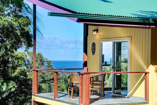 balcony with a patio and a water view