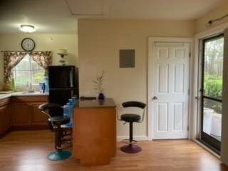 kitchen featuring black fridge and light wood-type flooring