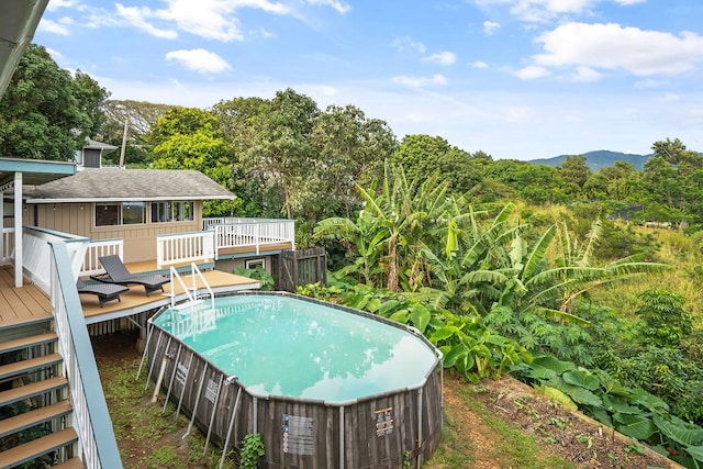 view of swimming pool featuring a wooden deck