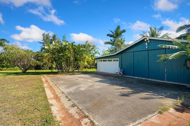 garage featuring a lawn