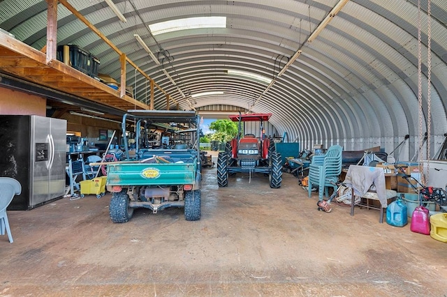 garage featuring stainless steel fridge