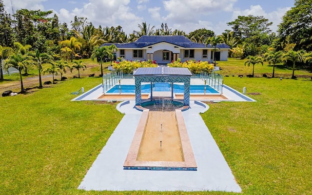 view of pool featuring a yard