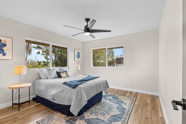 bedroom featuring light hardwood / wood-style flooring and ceiling fan