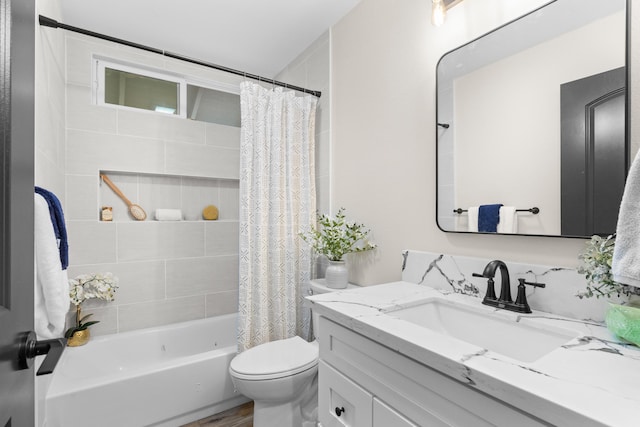 full bathroom with vanity, shower / bath combo, and toilet