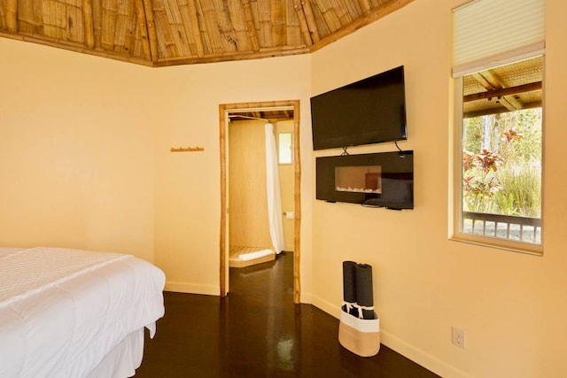 bedroom featuring wood ceiling, dark wood-type flooring, and vaulted ceiling