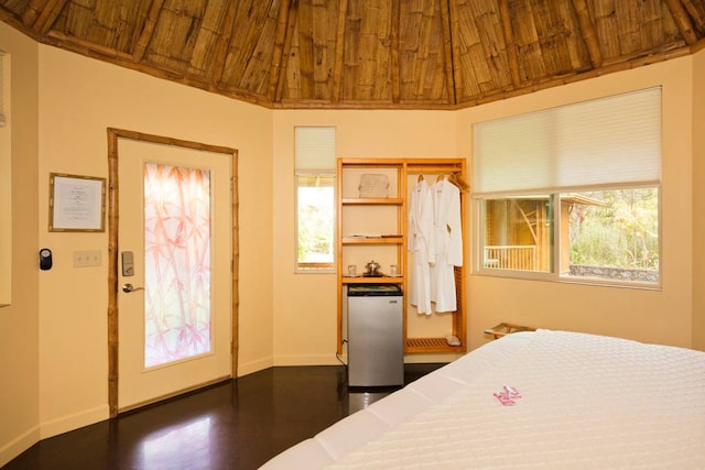 bedroom with wood ceiling, vaulted ceiling, and dark hardwood / wood-style flooring