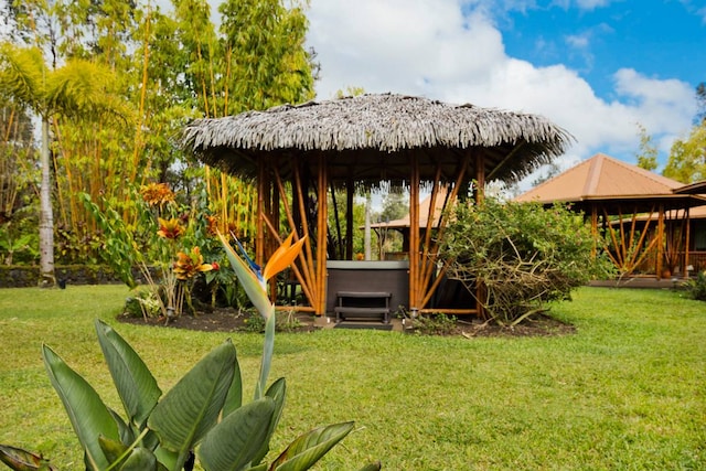 view of yard featuring a gazebo and a hot tub