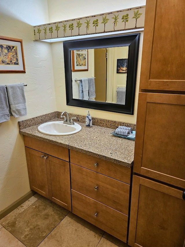 bathroom with vanity and tile patterned flooring