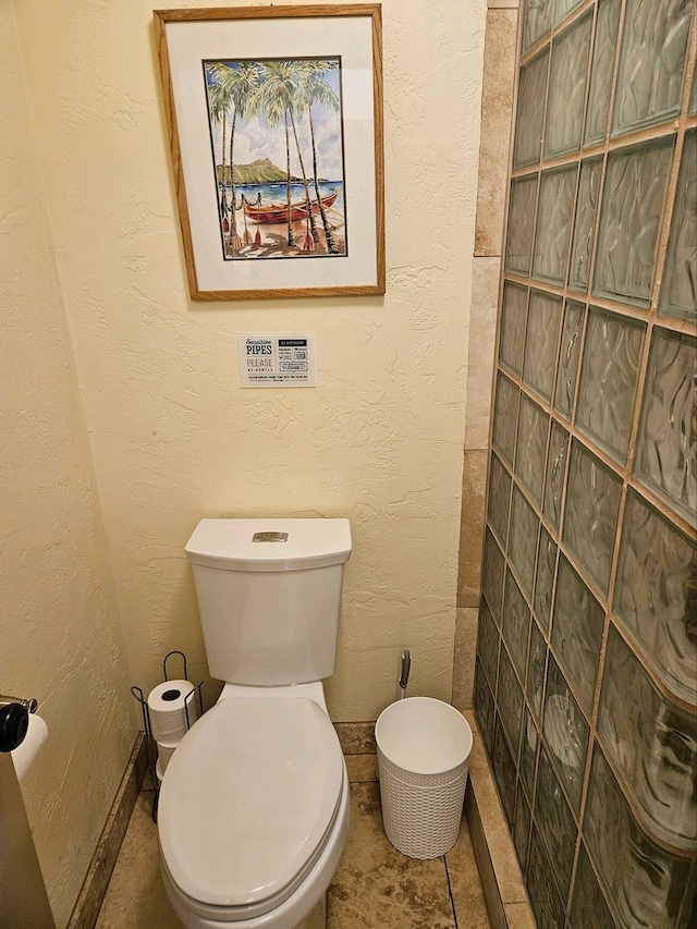 bathroom with tile patterned floors and toilet