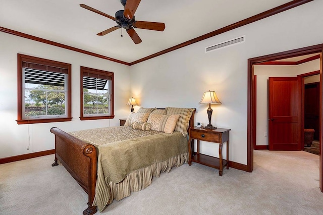 bedroom with ornamental molding, light carpet, and ceiling fan