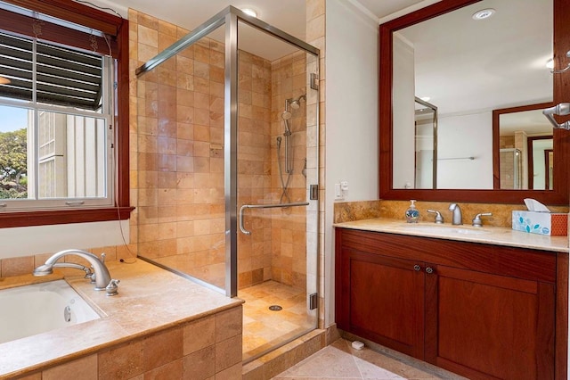 bathroom with independent shower and bath, vanity, and tile patterned flooring