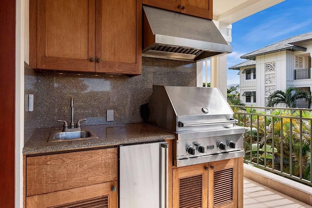 view of patio / terrace featuring area for grilling and sink