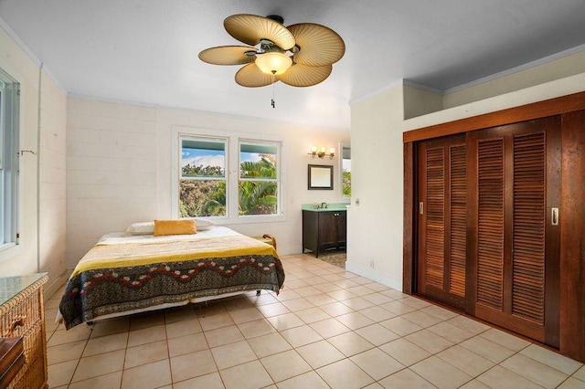 bedroom with ornamental molding, light tile flooring, and ceiling fan