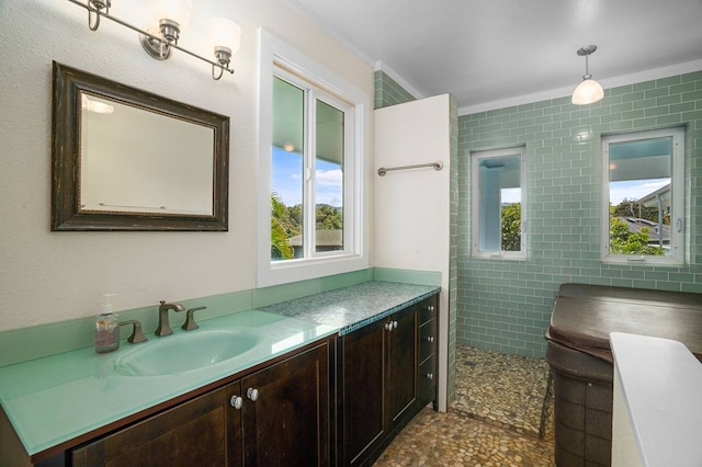 bathroom featuring tile walls, vanity, and tile floors