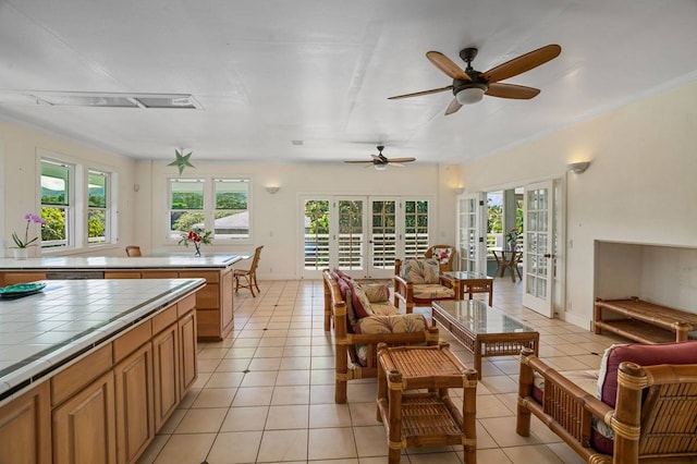 kitchen with french doors, tile countertops, ceiling fan, and a wealth of natural light