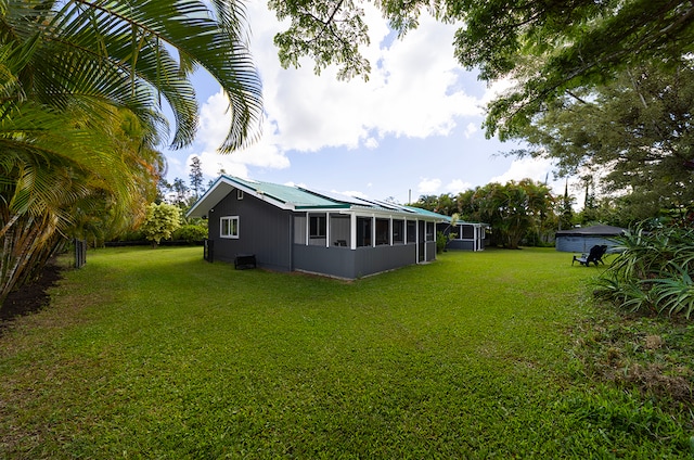 view of yard featuring a sunroom