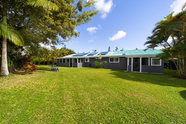 view of yard with a sunroom