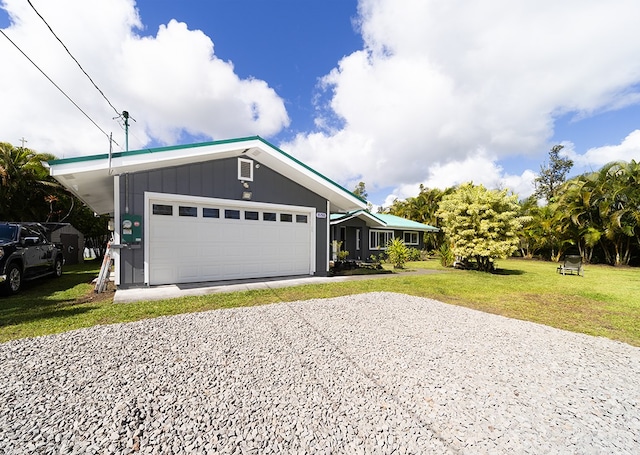 view of front facade with a front lawn and a garage