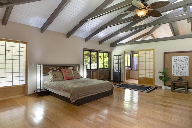 bedroom featuring ceiling fan, light hardwood / wood-style floors, beam ceiling, and high vaulted ceiling