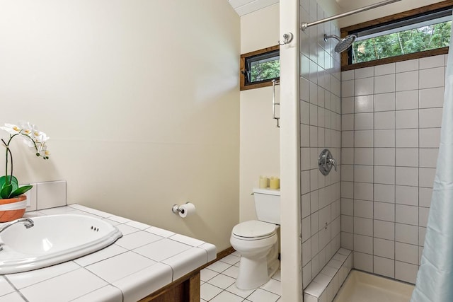 bathroom featuring tile patterned floors, a shower with curtain, toilet, and vanity