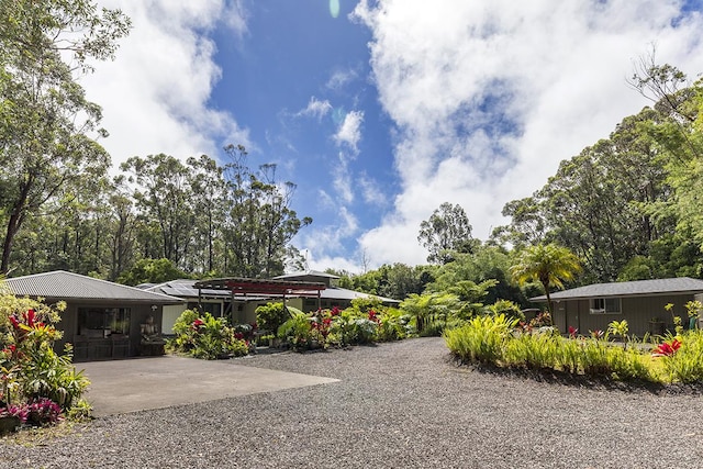 view of yard with an outbuilding and a patio