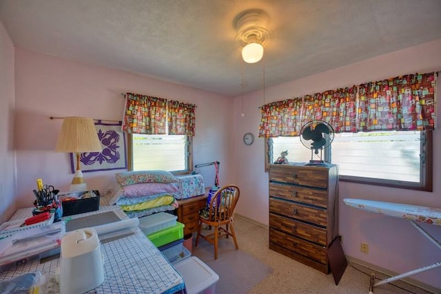 bedroom featuring ceiling fan and multiple windows