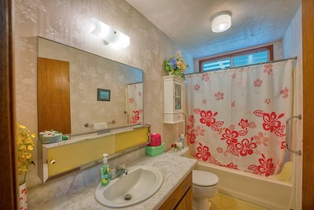 full bathroom featuring tile floors, toilet, vanity, and shower / tub combo