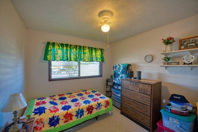 bedroom featuring ceiling fan and carpet floors