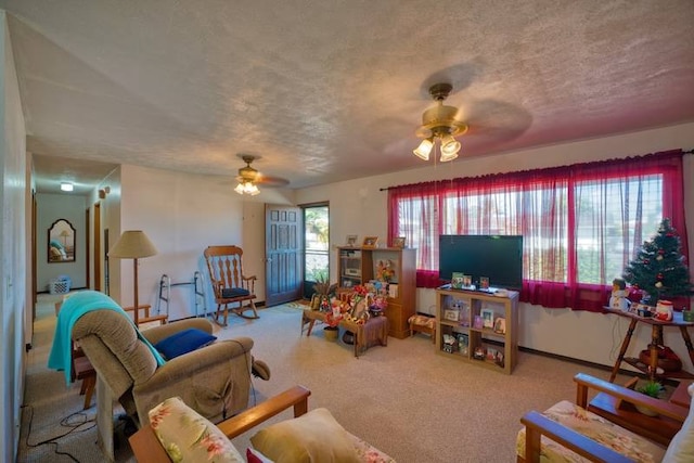 living room with light carpet, a textured ceiling, and ceiling fan